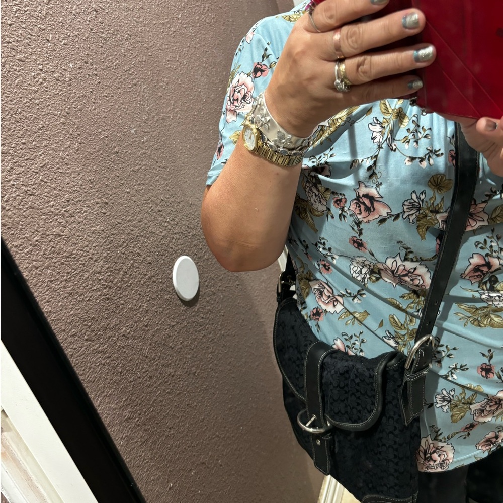 Coach crossbody bag on the back pocket has call outs used condition